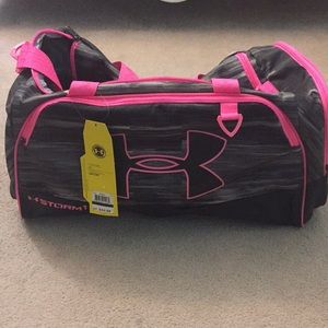 Pink and black Under Armour gym bag